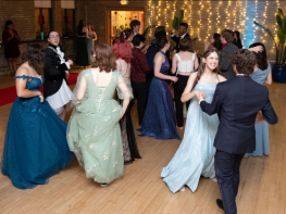 a group of students dance during a Prom