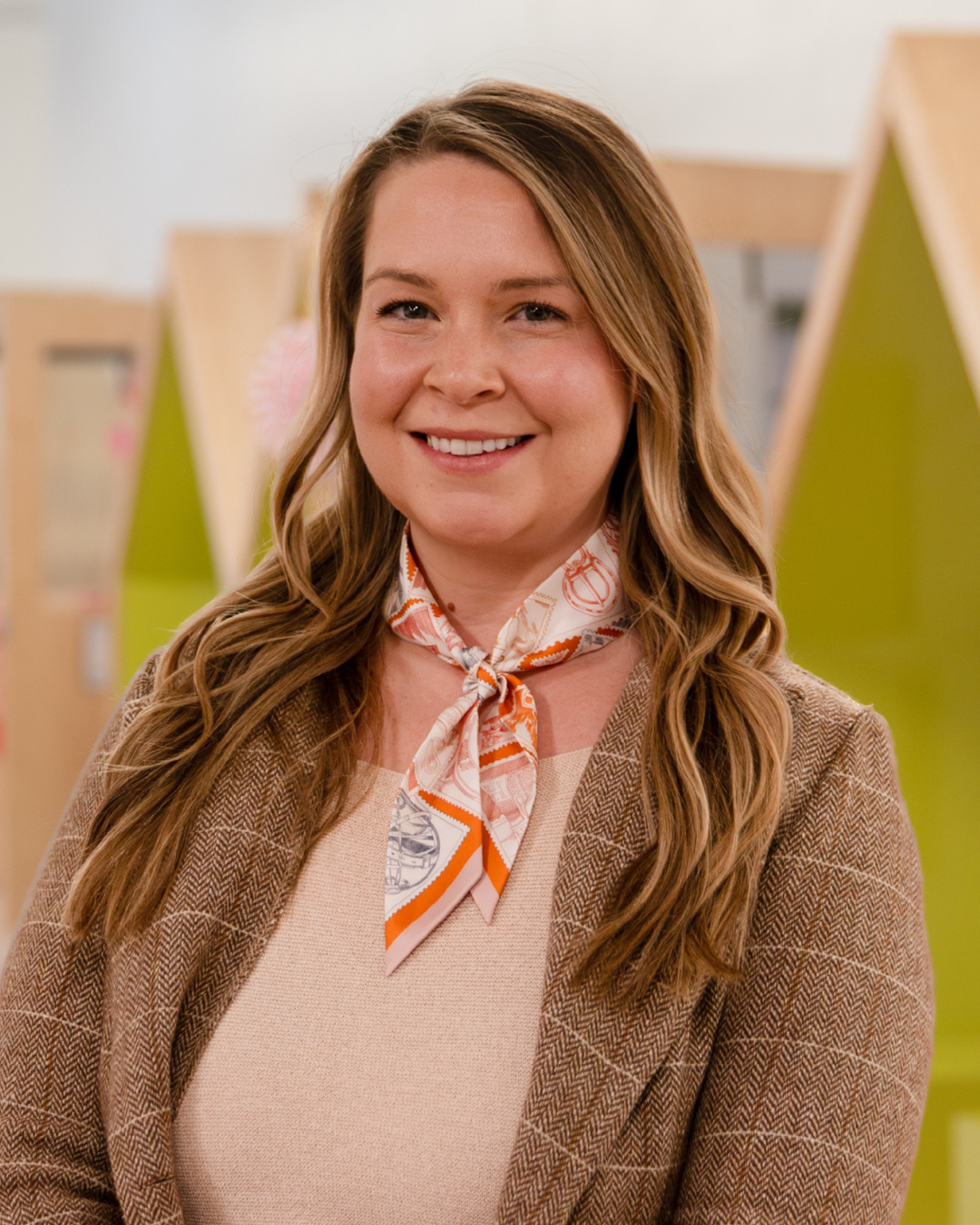 Woman smiles for professional headshot
