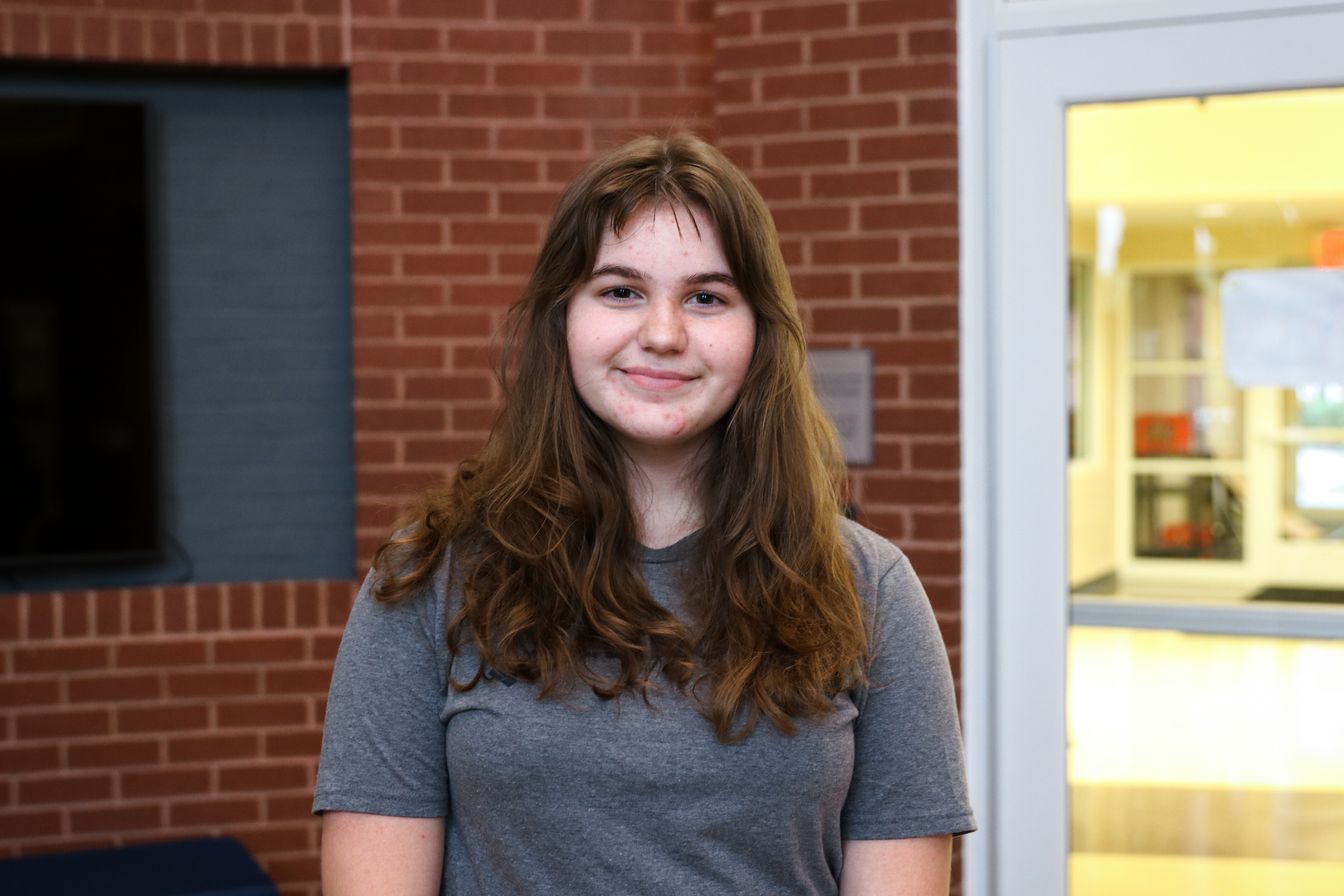 High school student poses for headshot
