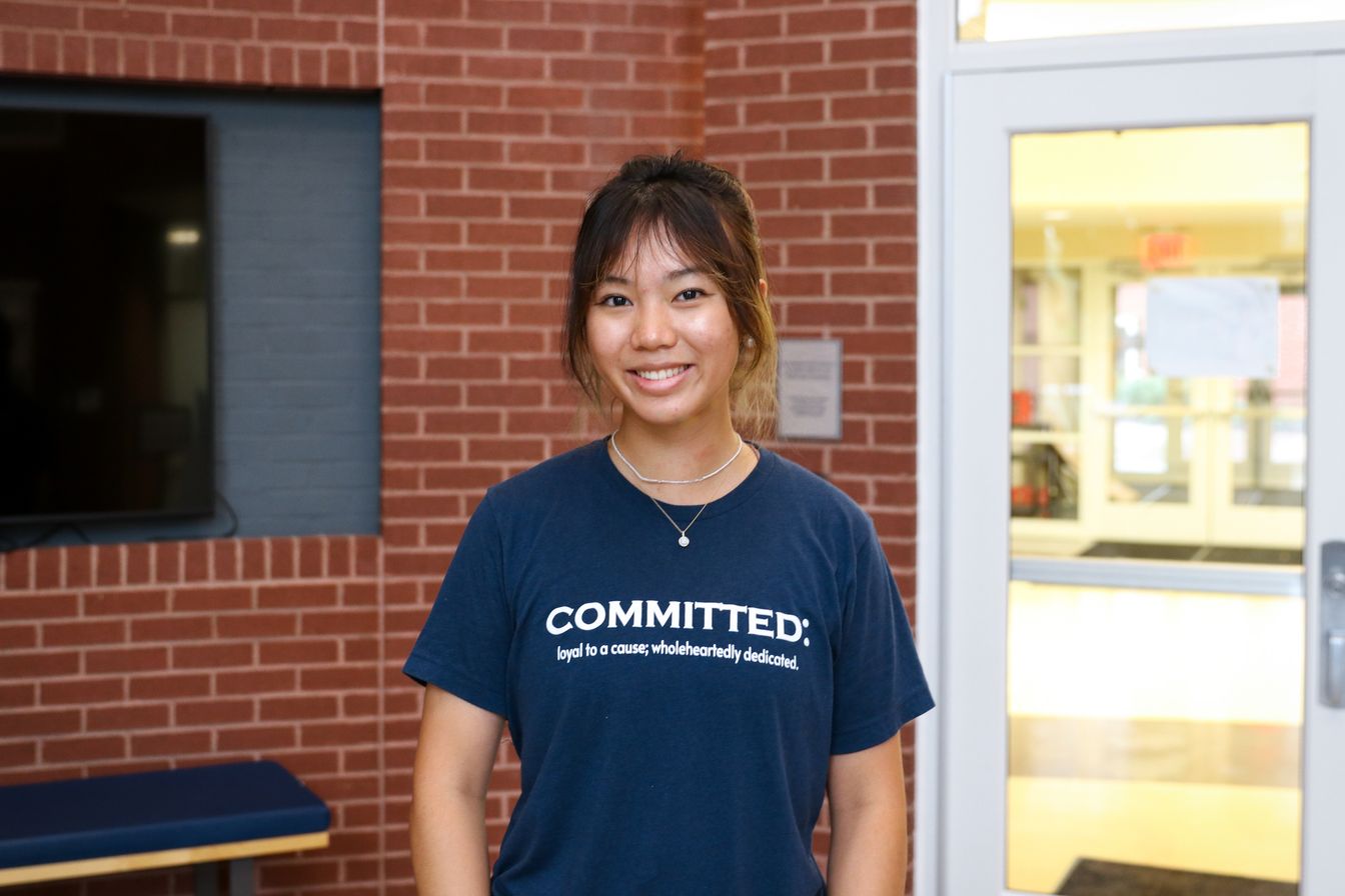High school student poses for headshot