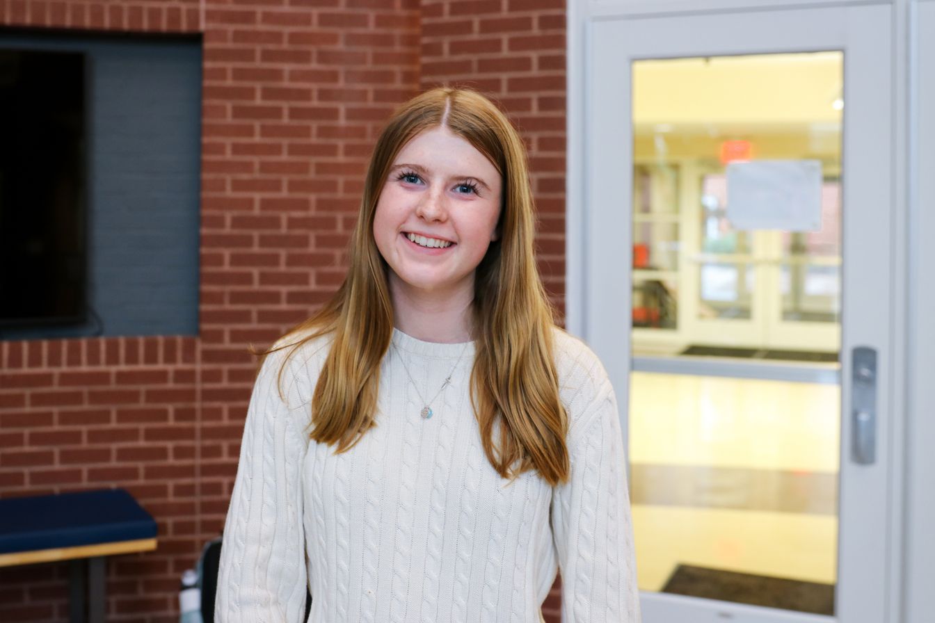 High school student poses for headshot
