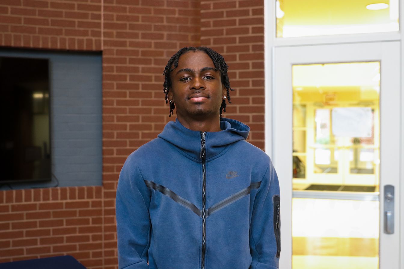 High school student poses for headshot