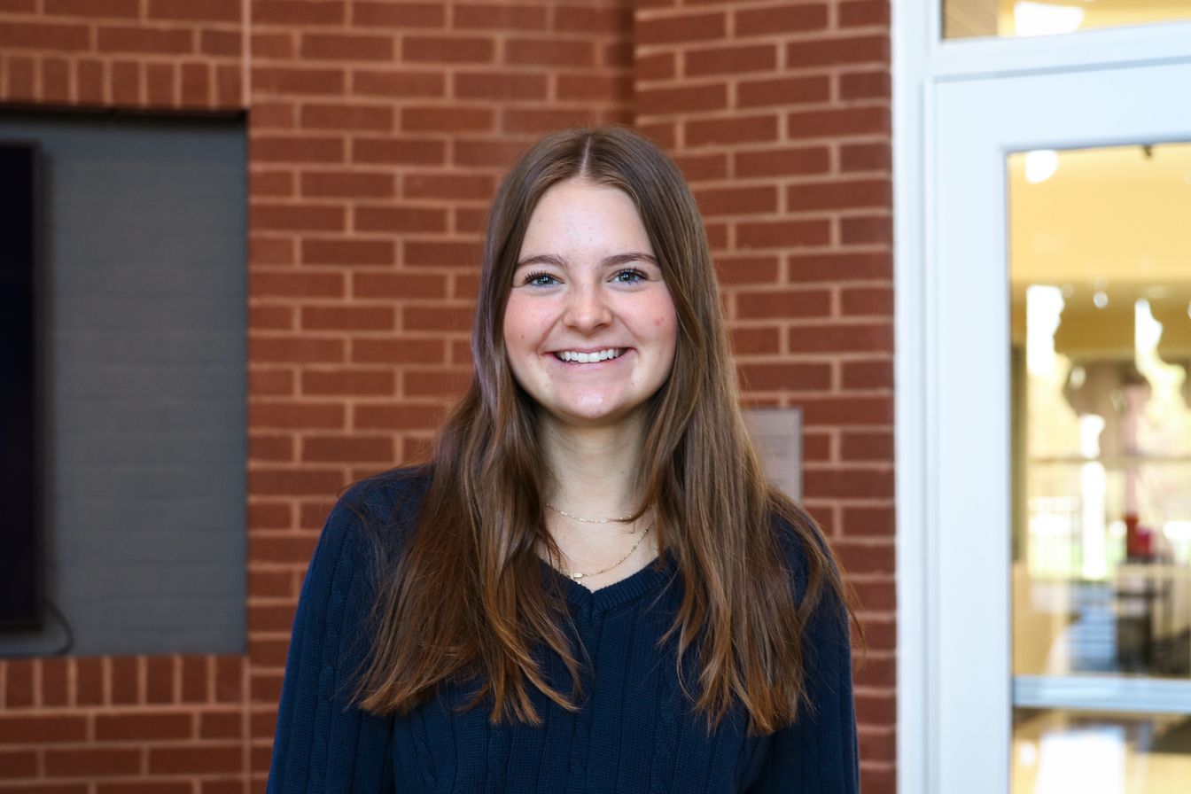 High school student poses for headshot