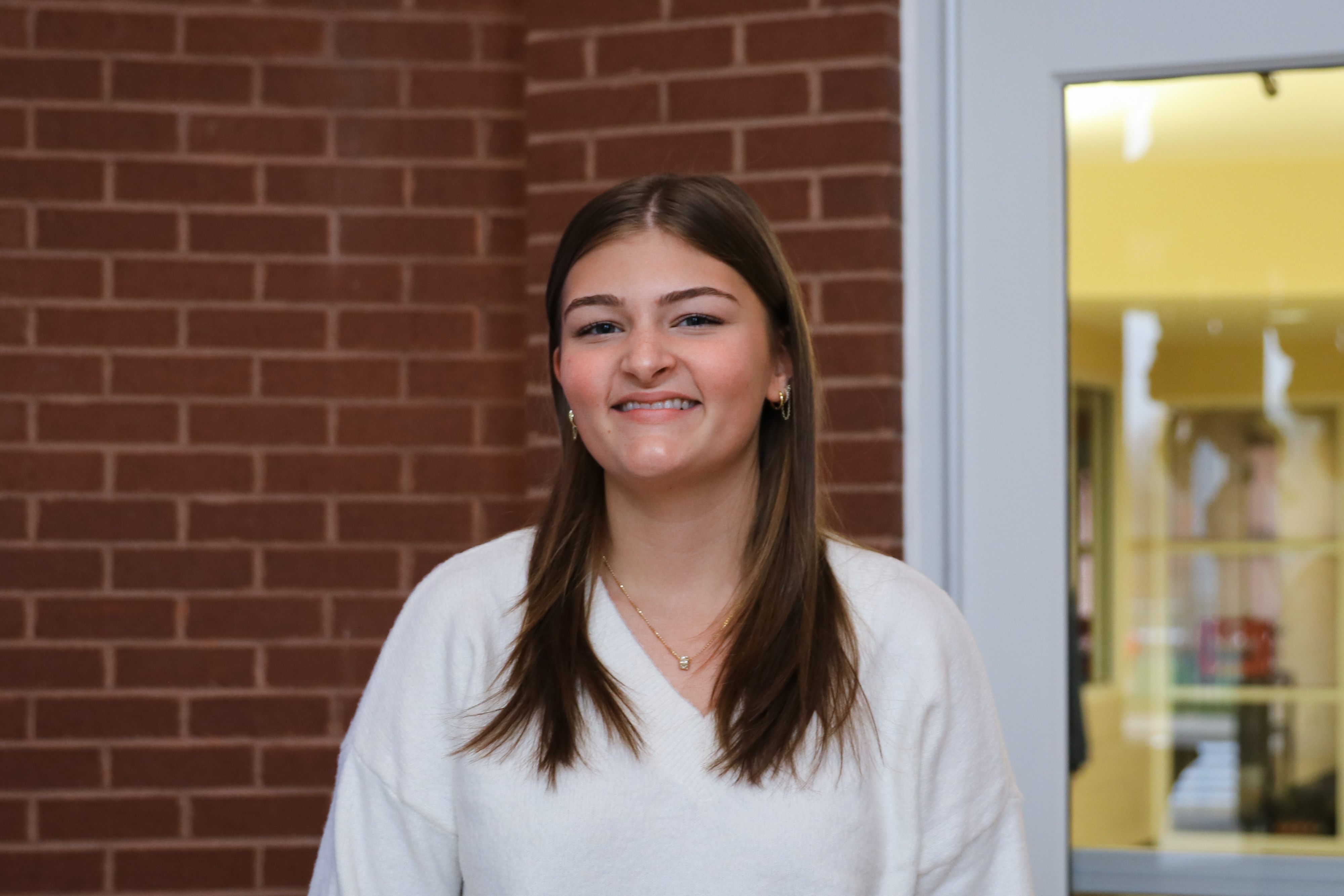 High school student poses for headshot