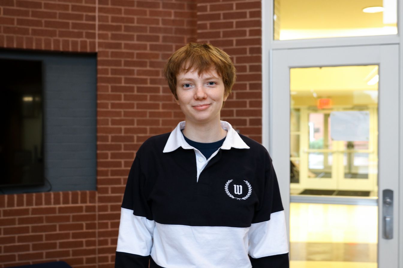 High school student poses for headshot