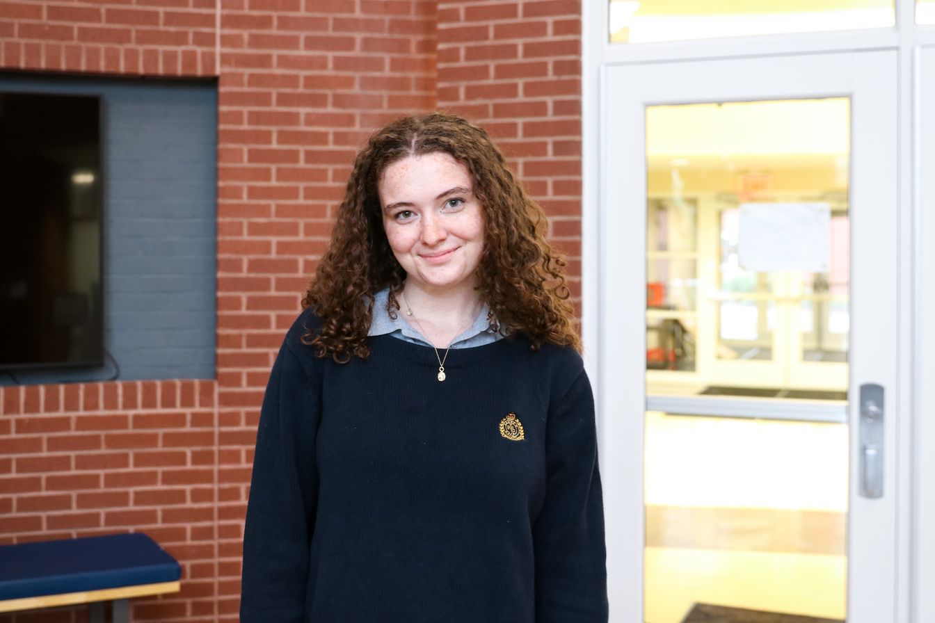 High school student poses for headshot
