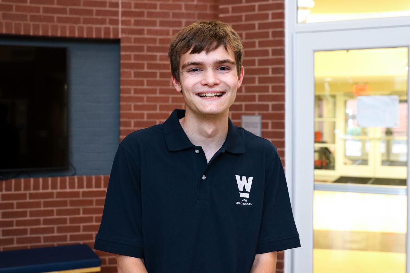 High school student poses for headshot