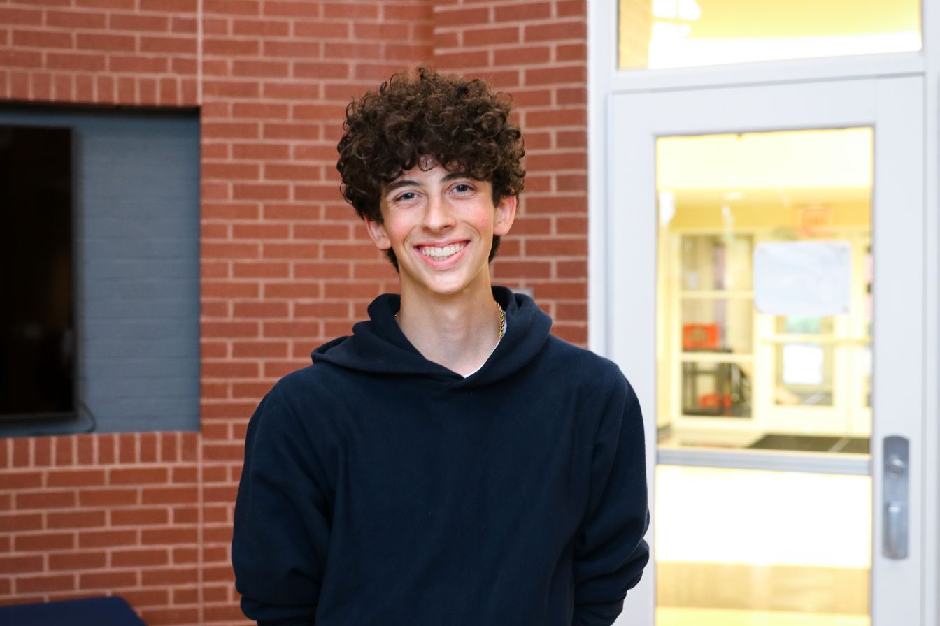 High school student poses for headshot