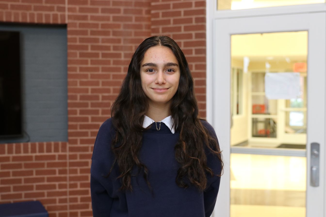 High school student poses for headshot