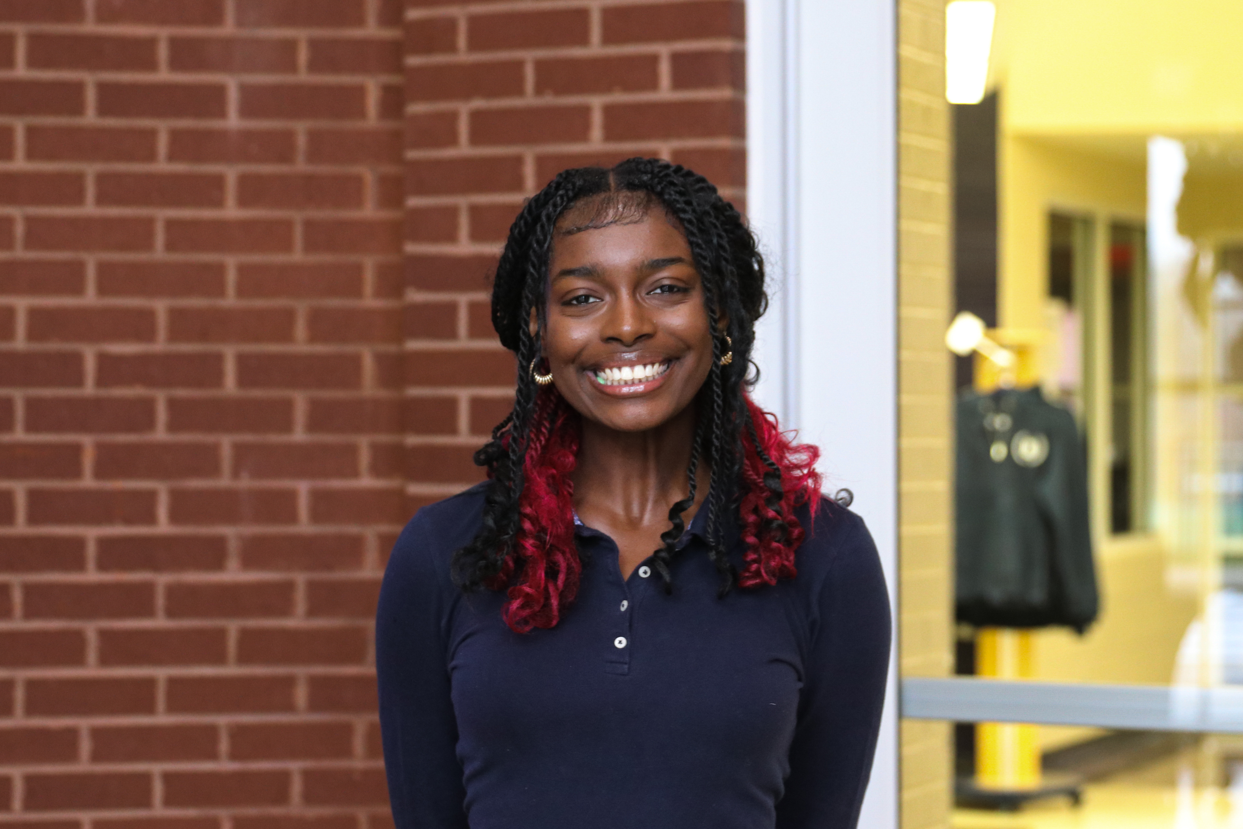 High school student poses for headshot